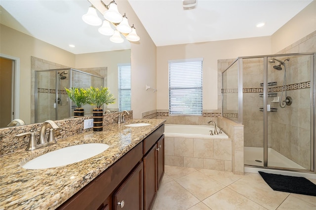 bathroom with vanity, separate shower and tub, an inviting chandelier, and tile patterned floors