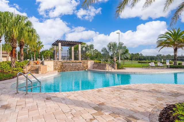 view of swimming pool with a pergola and a patio area