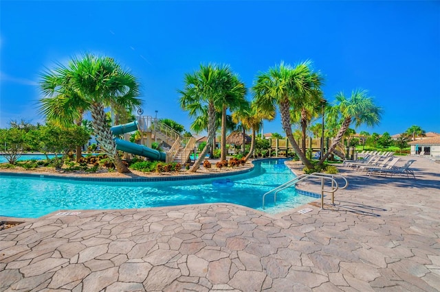 view of pool featuring a water slide