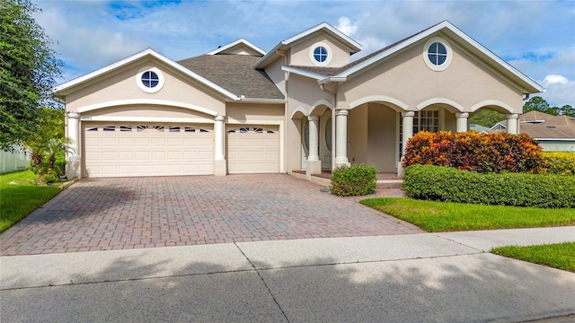 view of front of property with a garage