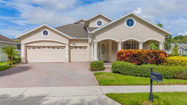 view of front of property with a garage