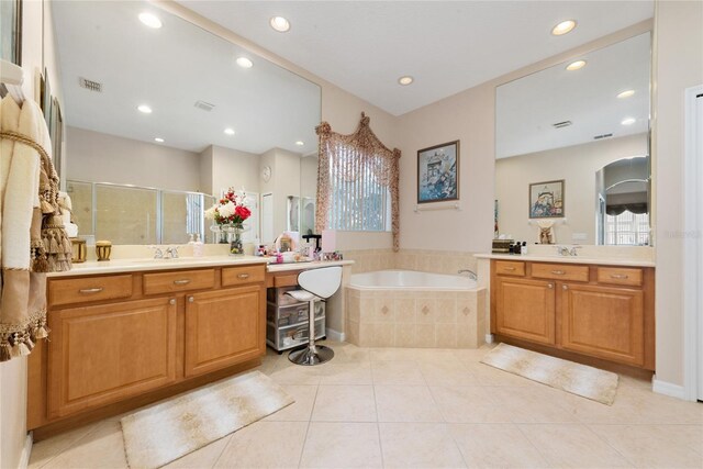 bathroom with vanity, independent shower and bath, and tile patterned floors