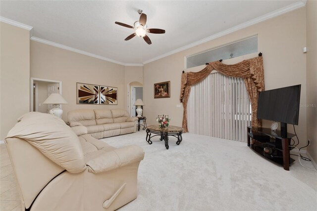 living room with crown molding, ceiling fan, and carpet flooring