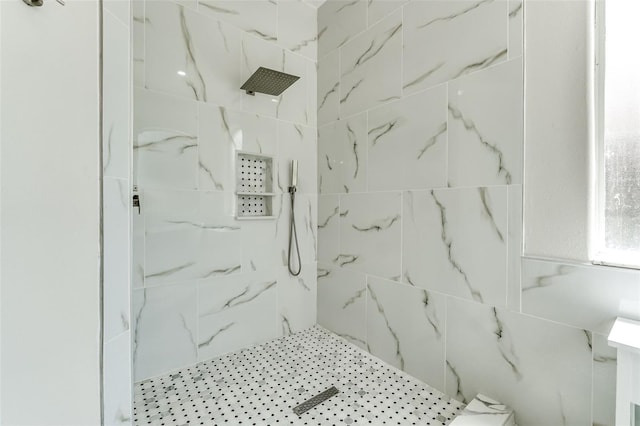 bathroom with a tile shower