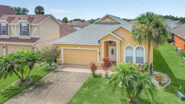 view of front facade with a garage and a front lawn