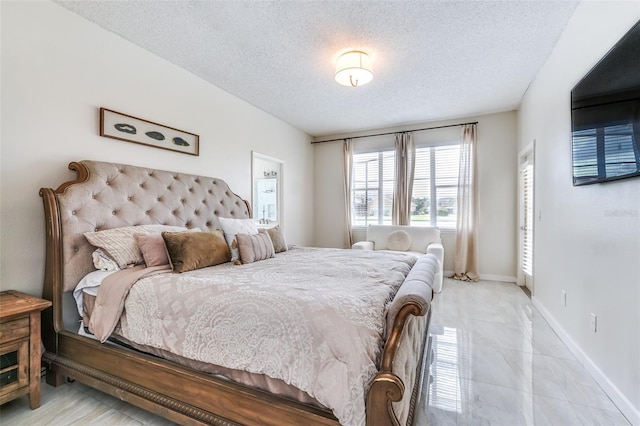 bedroom featuring a textured ceiling