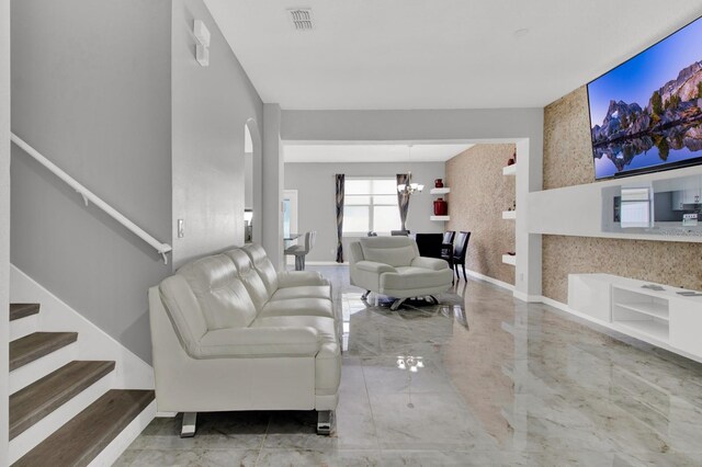 living room featuring an inviting chandelier