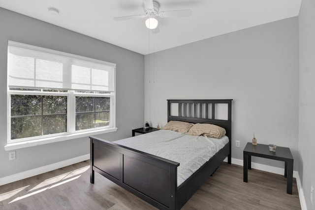 bedroom featuring ceiling fan and hardwood / wood-style floors