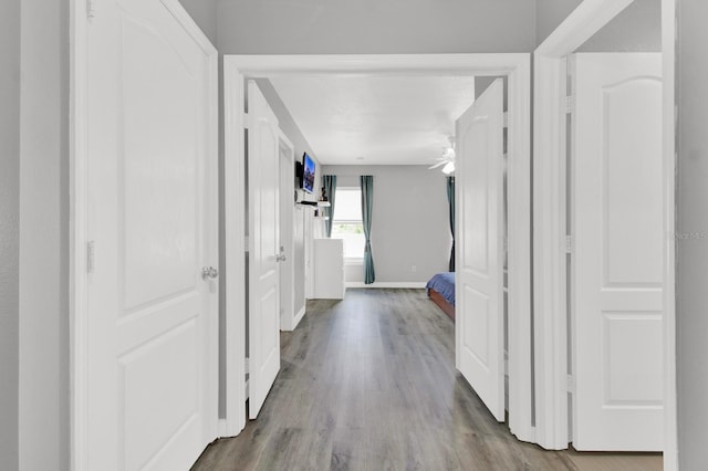 corridor with light wood-type flooring