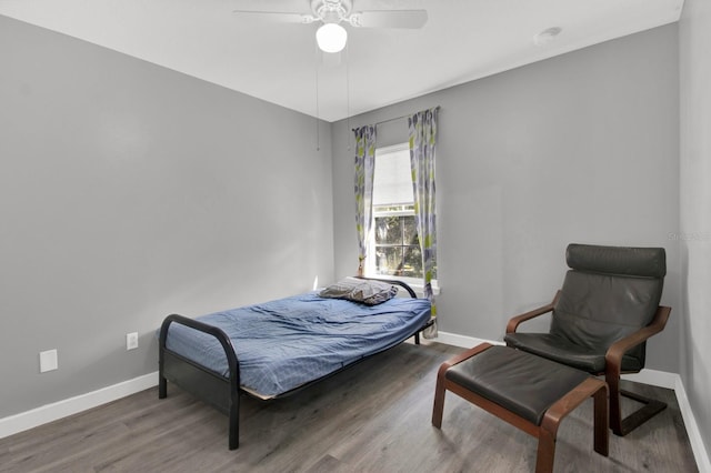 bedroom featuring wood-type flooring and ceiling fan