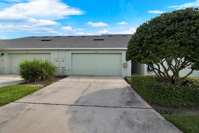 ranch-style home with a garage