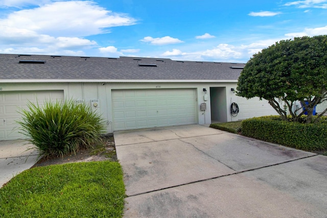 ranch-style home featuring a garage