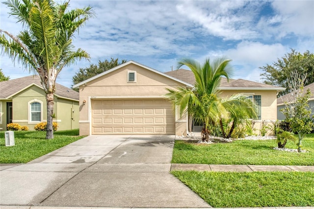 ranch-style house with a garage and a front yard