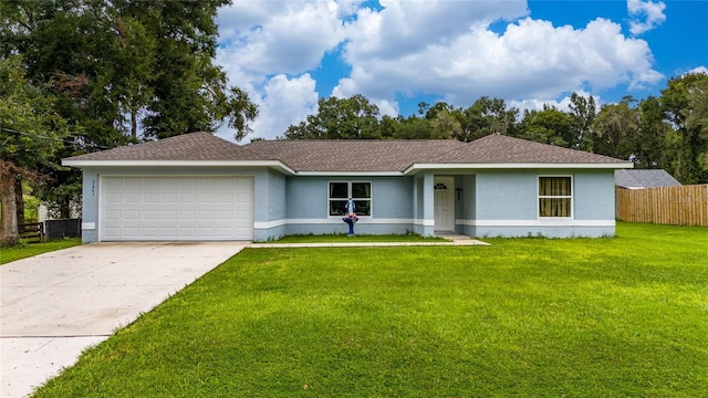 ranch-style house featuring a garage and a front yard