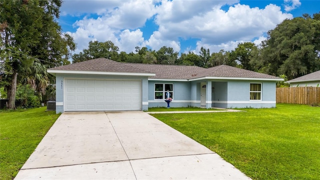 ranch-style house featuring a front yard and a garage