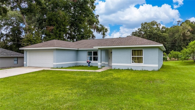 ranch-style house featuring a garage and a front lawn