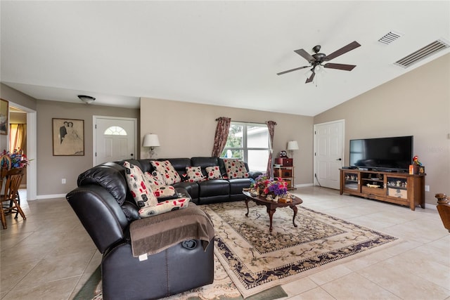 living room with vaulted ceiling, light tile patterned floors, and ceiling fan