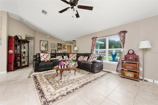 living room with vaulted ceiling, ceiling fan, and light tile patterned flooring