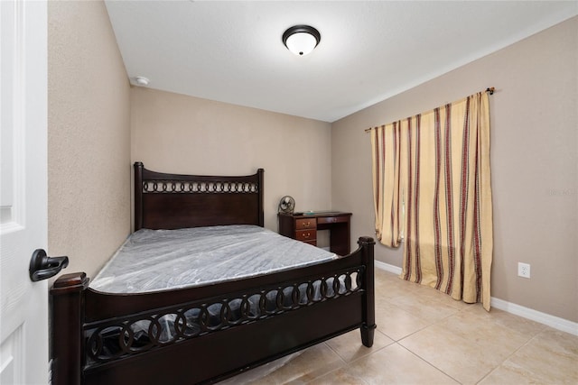 bedroom featuring light tile patterned flooring