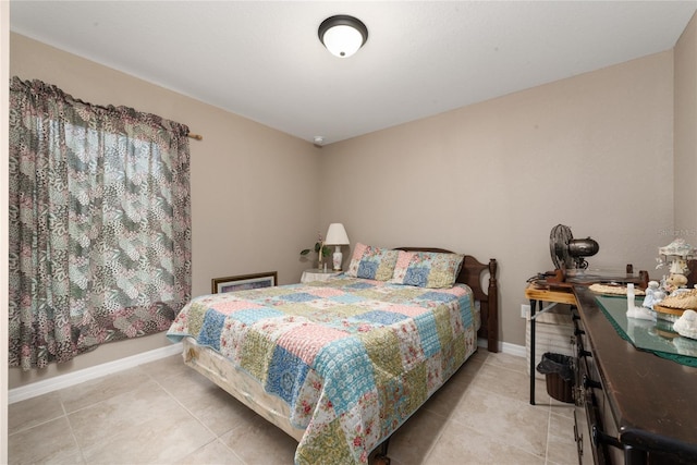 bedroom featuring light tile patterned floors