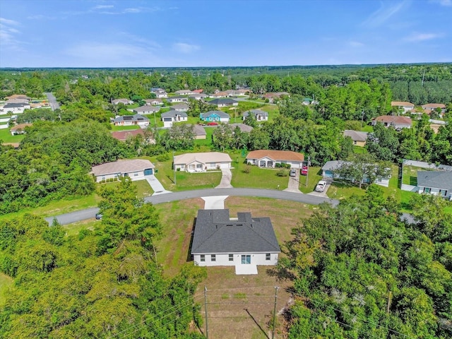 bird's eye view with a forest view and a residential view