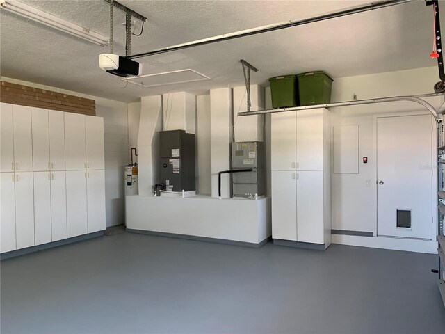 14421 Hatchee Ct, Orlando, FL 32837 - garage with a garage door opener, heating unit, and water heater
