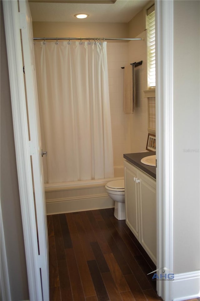 14421 Hatchee Ct, Orlando, FL 32837 - full bath with vanity, wood finished floors, toilet, and shower / tub combo