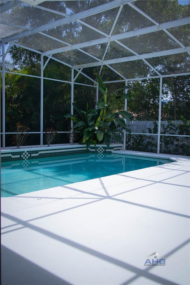 14421 Hatchee Ct, Orlando, FL 32837 - view of swimming pool featuring a fenced in pool, a lanai, and a patio