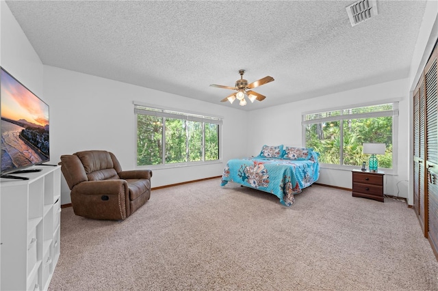 1775 Sundance Dr, Saint Cloud, FL 34771 - bedroom featuring carpet floors, baseboards, a textured ceiling, and ceiling fan