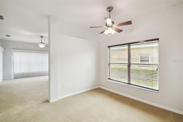 unfurnished room with light carpet and ceiling fan