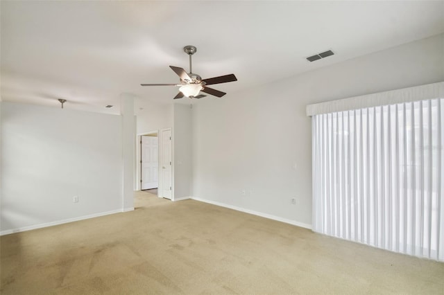 carpeted empty room featuring ceiling fan