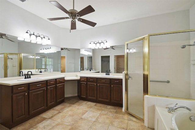 bathroom featuring ceiling fan, vanity, and plus walk in shower