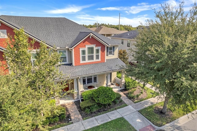 2917 Windmill Dr, Kissimmee, FL 34741 - view of front of home featuring a porch and a shingled roof