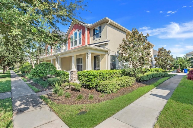 2917 Windmill Dr, Kissimmee, FL 34741 - view of side of home featuring stucco siding and a porch