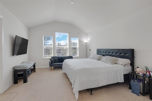 carpeted bedroom with vaulted ceiling