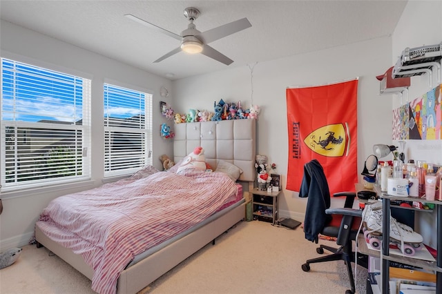 2917 Windmill Dr, Kissimmee, FL 34741 - carpeted bedroom with a ceiling fan and baseboards
