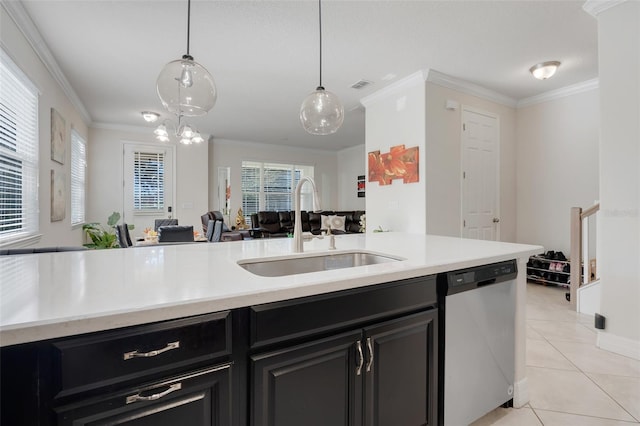 kitchen featuring stainless steel dishwasher, sink, plenty of natural light, and decorative light fixtures