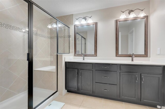 2917 Windmill Dr, Kissimmee, FL 34741 - bathroom with a sink, tile patterned flooring, a stall shower, and double vanity