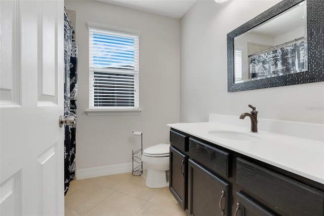 bathroom featuring vanity, toilet, and tile patterned floors