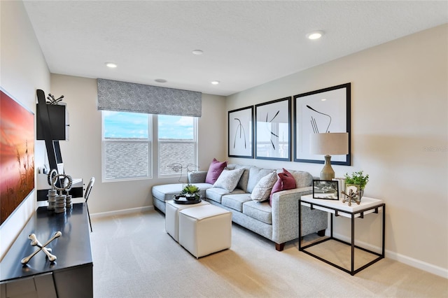 carpeted living room with a textured ceiling