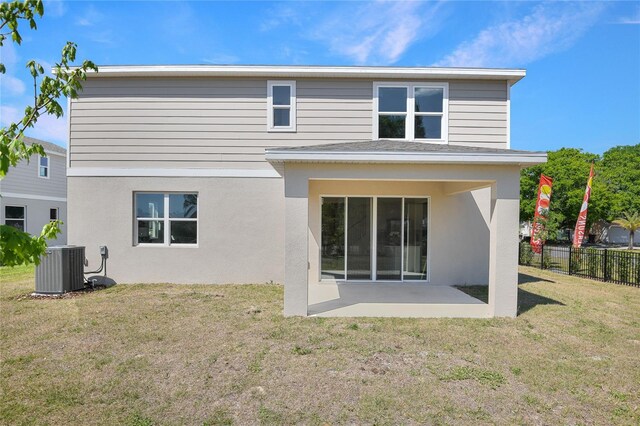 500 Summit River Dr, Apopka, FL 32712 - rear view of property with cooling unit, stucco siding, fence, a patio, and a yard