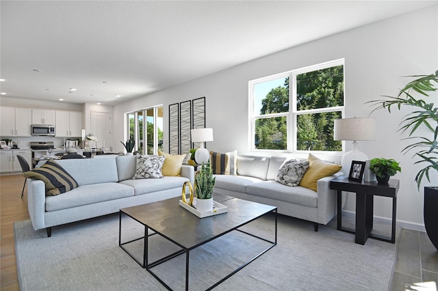 500 Summit River Dr, Apopka, FL 32712 - living room with light wood-type flooring, baseboards, and recessed lighting