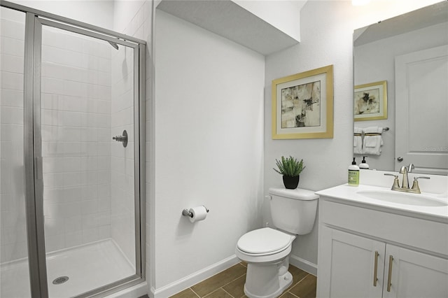 500 Summit River Dr, Apopka, FL 32712 - bathroom featuring toilet, vanity, a stall shower, and baseboards