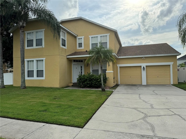 front of property featuring a garage and a front lawn