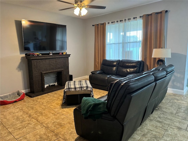 tiled living room with ceiling fan