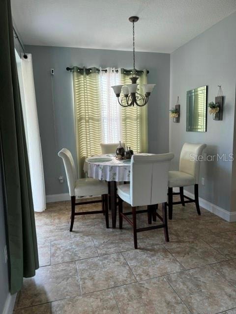 dining room with a notable chandelier