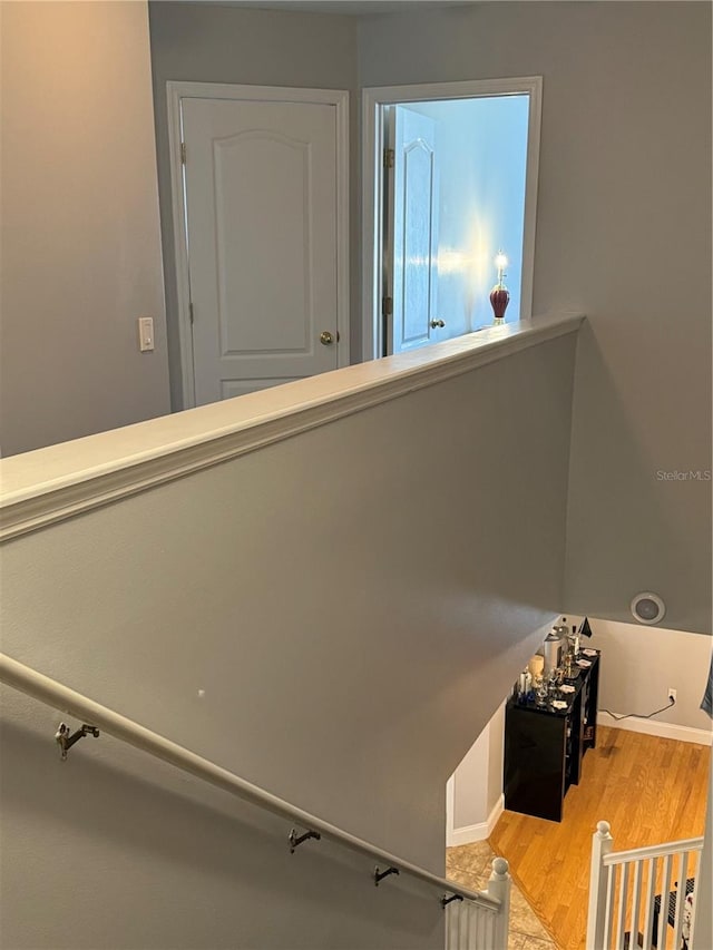 staircase featuring hardwood / wood-style floors