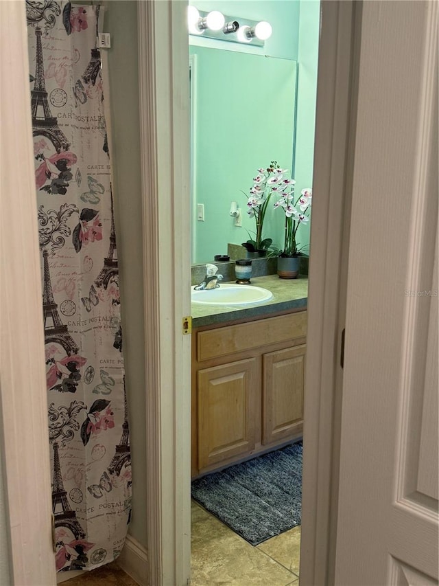 bathroom featuring vanity and tile patterned flooring