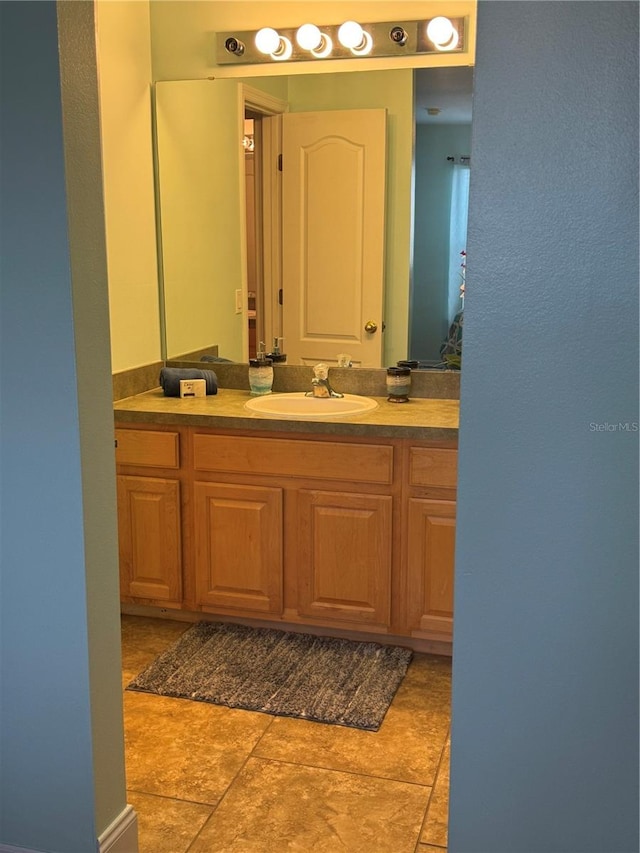 bathroom with vanity and tile patterned flooring