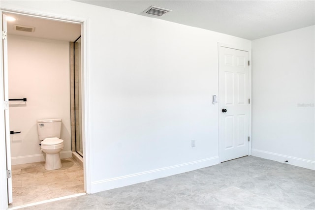 unfurnished bedroom featuring ensuite bath